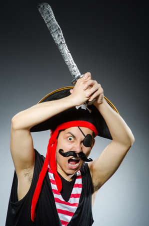 Funny pirate in the dark studioの写真素材