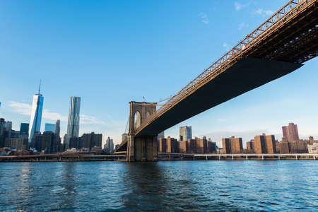 Brooklyn bridge in New York on bright summer dayの写真素材