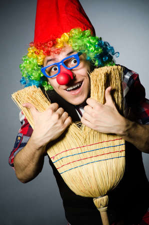 Funny clown with the broomの写真素材