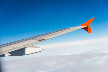 Airplane wing out of windowの写真素材