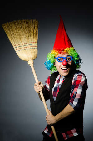 Funny clown with the broomの写真素材