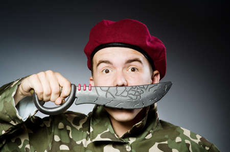 Funny soldier against the dark backgroundの写真素材