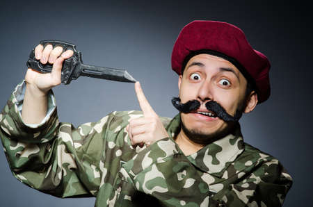 Funny soldier against the dark backgroundの写真素材
