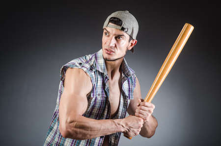 Violent man with baseball bat and hatの写真素材