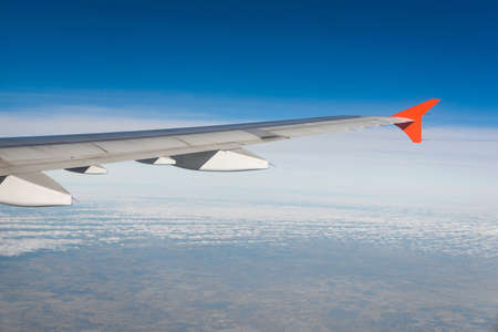 Airplane wing out of windowの写真素材