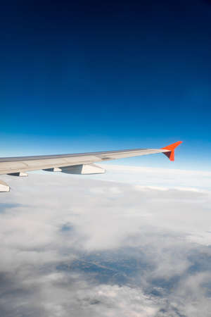 Airplane wing out of windowの写真素材