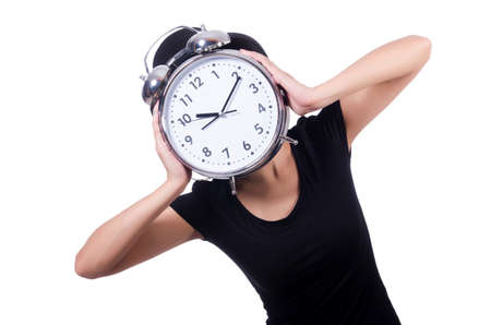 Young woman with clock isolated on whiteの写真素材