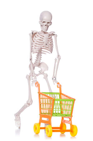 Skeleton with shopping cart trolley isolated on whiteの写真素材
