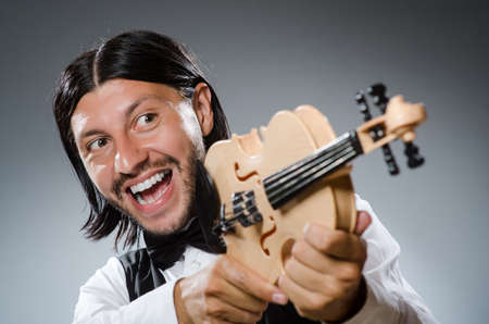 Funny fiddle violin player in musical conceptの写真素材