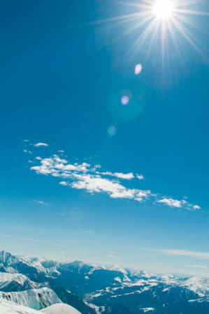 Snow mountains on bright winter dayの写真素材