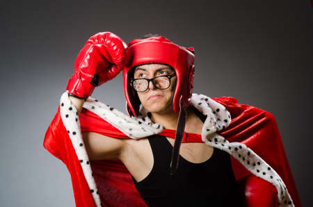 Funny boxer with red gloves against dark backgroundの写真素材