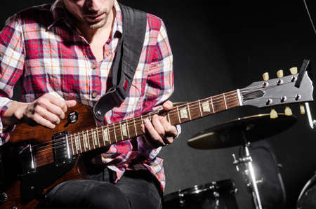Man with guitar during concert