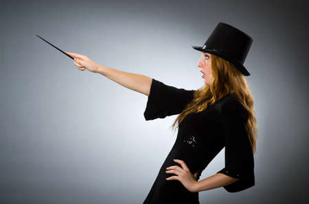 Woman magician doing her tricks with wandの写真素材