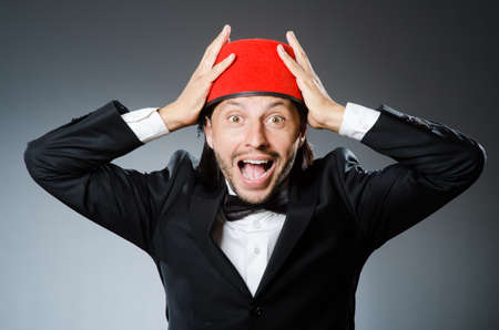 Man in traditional turkish hat and dressの写真素材