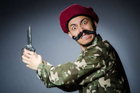 Funny soldier against the dark backgroundの写真素材