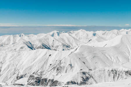 Snow mountains on bright winter day