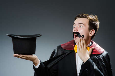 Funny magician with wand and hatの写真素材