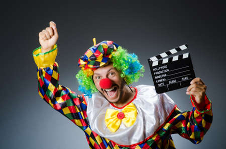 Clown with movie clapper boardの写真素材