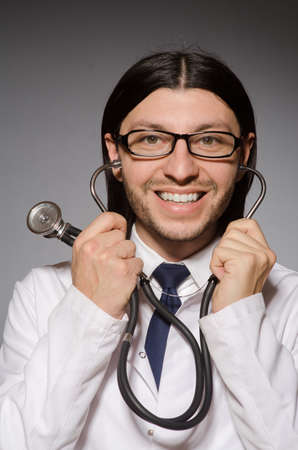 Young doctor with stethoscope in medical conceptの写真素材