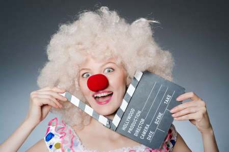 Clown with movie clapper boardの写真素材