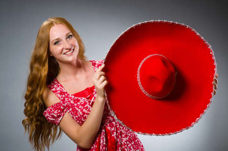 Mexican woman wearing red sombreroの写真素材