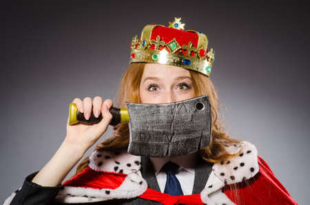 Woman queen businesswoman with axeの写真素材