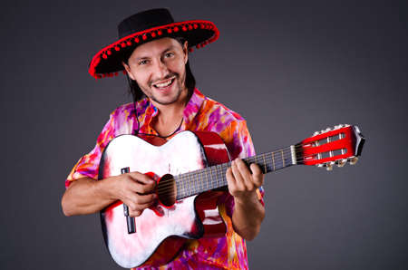Man wearing sombrero with guitar