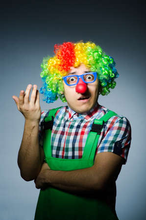 Funny clown against the dark backgroundの写真素材