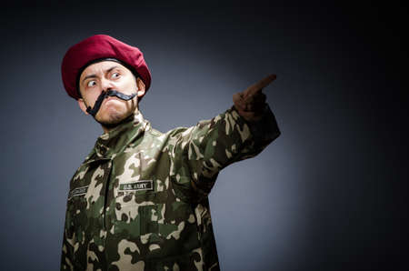 Funny soldier in military concept