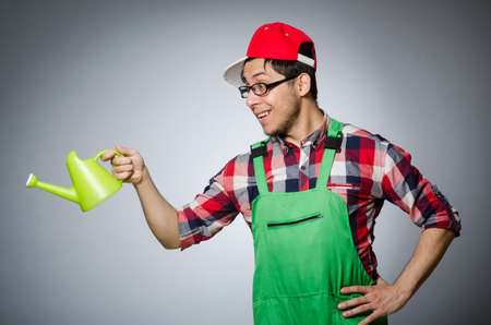 Funny man with watering canの写真素材