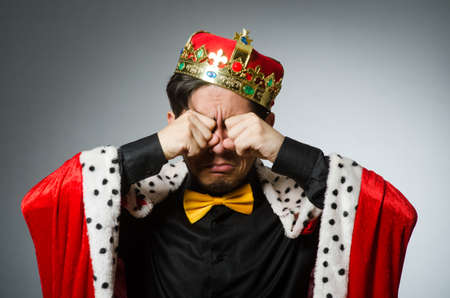 Concept with funny man wearing crown