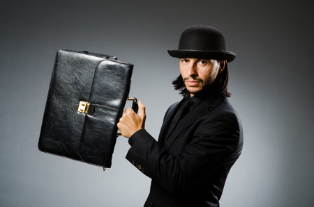 Businessman wearing vintage concept with briefcaseの写真素材