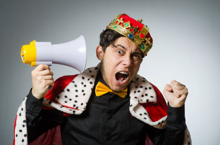 Concept with funny man wearing crown