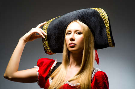 Woman pirate against grey backgroundの写真素材