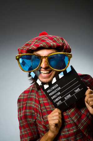 Funny scotsman with movie clapboardの写真素材