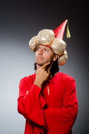 Funny wizard wearing red dressの写真素材