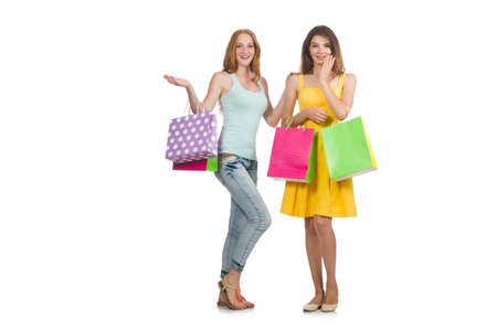 Friends with shopping bags isolated on whiteの写真素材