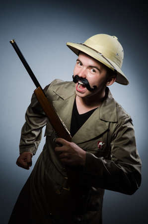 Man in safari hat in hunting concept