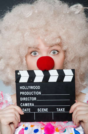 Clown with movie clapper boardの写真素材