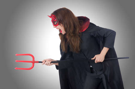 Female wearing devil costume and tridentの写真素材