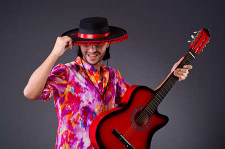 Man wearing sombrero with guitar