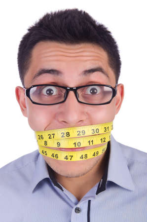 Man with centimeter in dieting conceptの写真素材