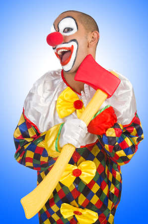 Clown with axe isolated on whiteの写真素材
