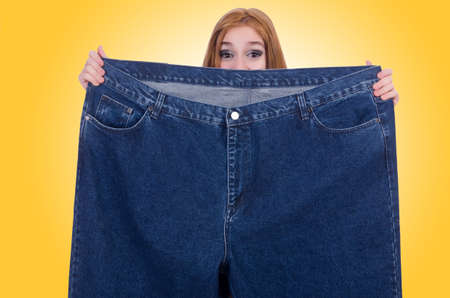 Dieting concept with oversize jeansの写真素材