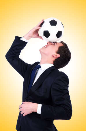 Man with football isolated on whiteの写真素材