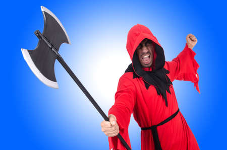 Executioner in red costume with axe on whiteの写真素材