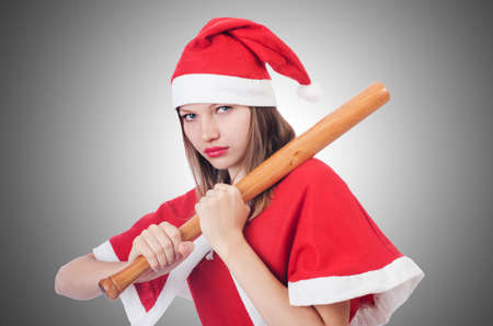 Young woman in red santa costume on whiteの写真素材