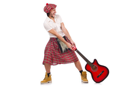 Scotsman playing guitar isolated on whiteの写真素材