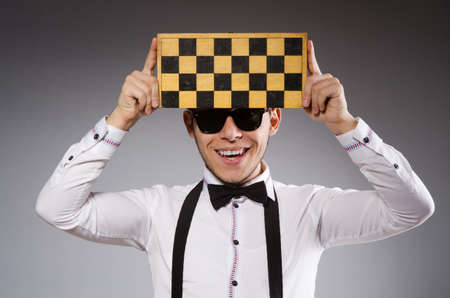 Funny chess player with boardの写真素材