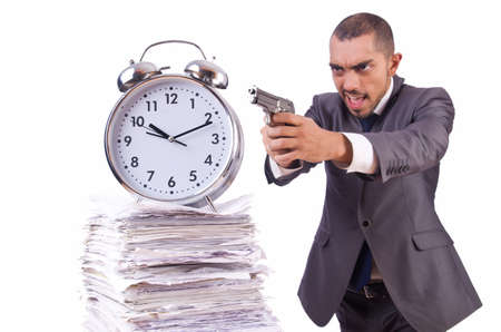 Angry businessman with stack of papersの写真素材